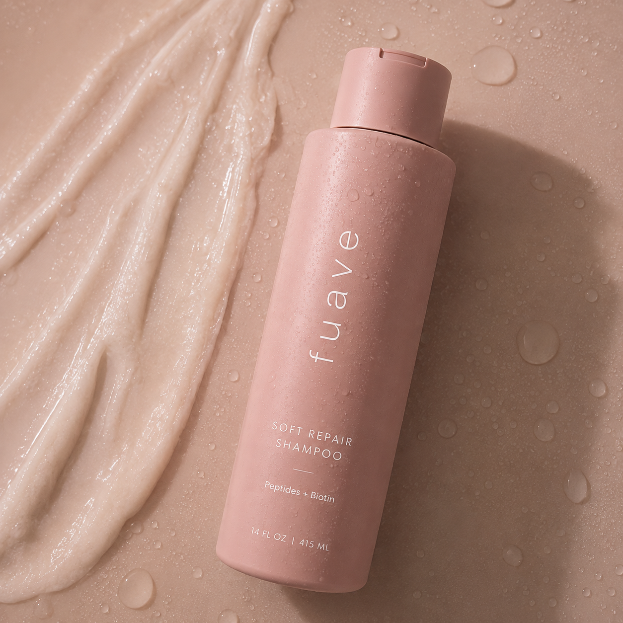FUAVE Soft Repair Shampoo with a pearlescent cream smear on a warm background
